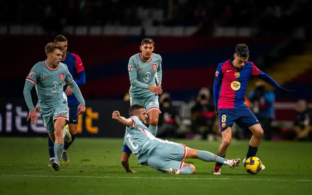 Atlético Madrid Player Koke sliding tackle during the game against FC Barcelona. 