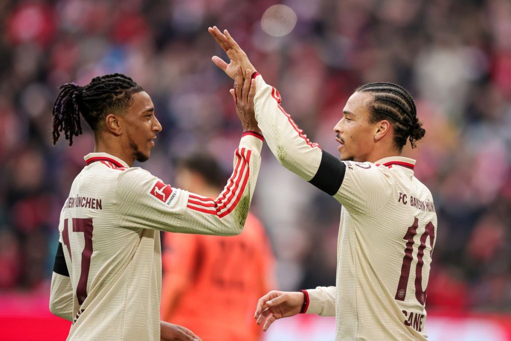 Bayern munich Leory Sane celebrates his goal with Michael Olise.